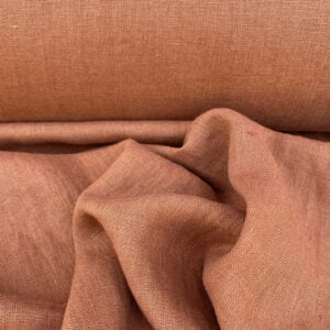 100% Linen fabric with a super soft drape in a soft terracotta. This mid weight linen is suitable for curtains and blinds where a good drape is uppermost.