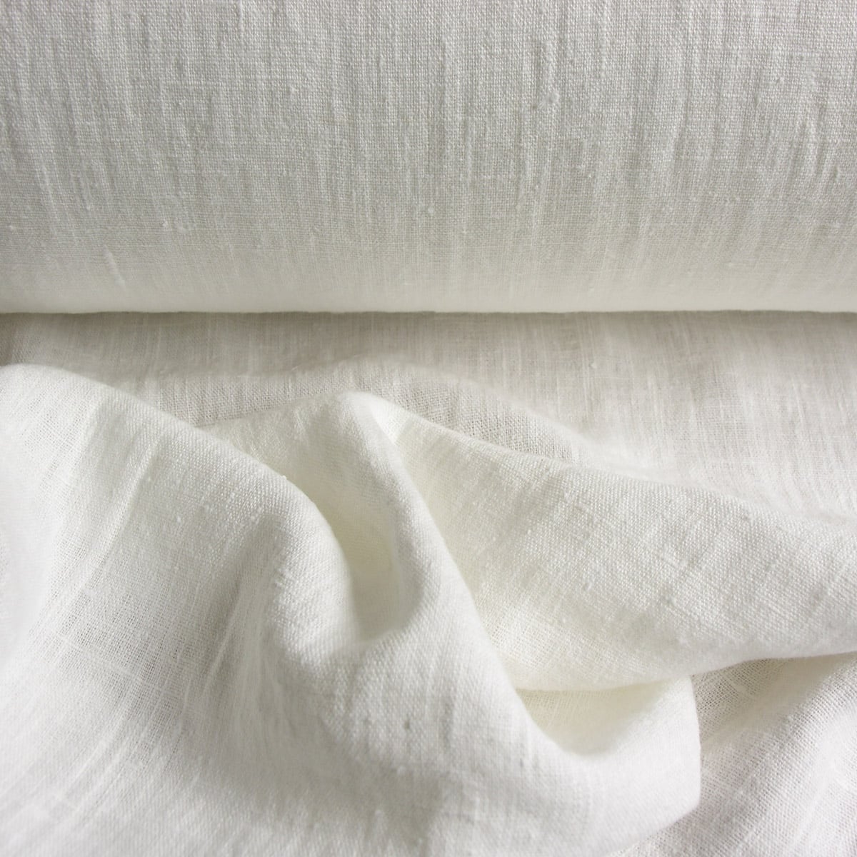 100% Linen fabric with a super soft drape, in a white just off bright white.