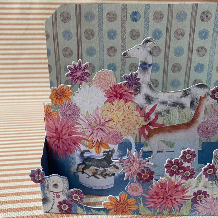 Angie Lewin 3D card with multicoloured flowers and dogs