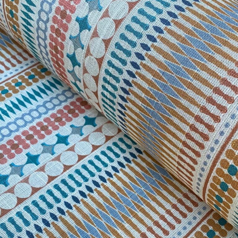 Tinsmiths Omega Stripe patterned fabric roll in teal & orange