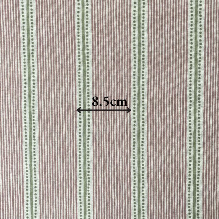 Pink & Green striped fabric on a roll at an angle