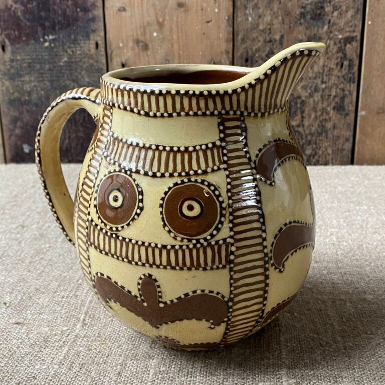 Carole Glover Slipware Noggin Jug against wooden background