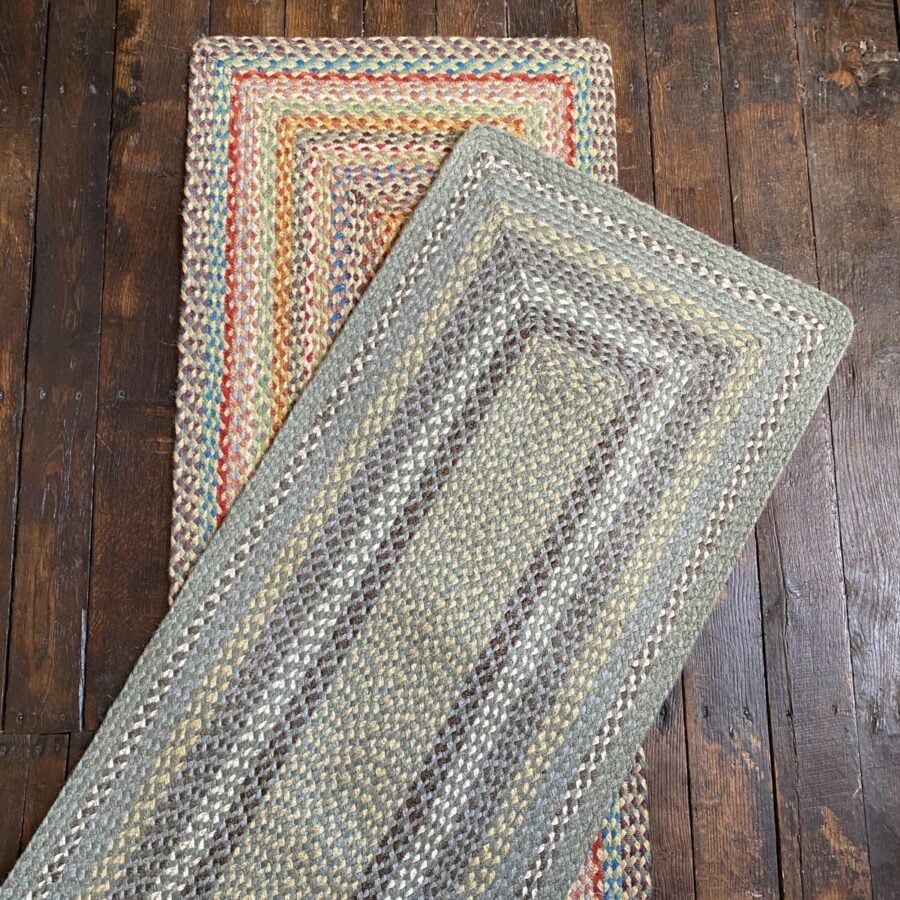 Flatlay of a pair of braided jute runners lying on a wooden floor