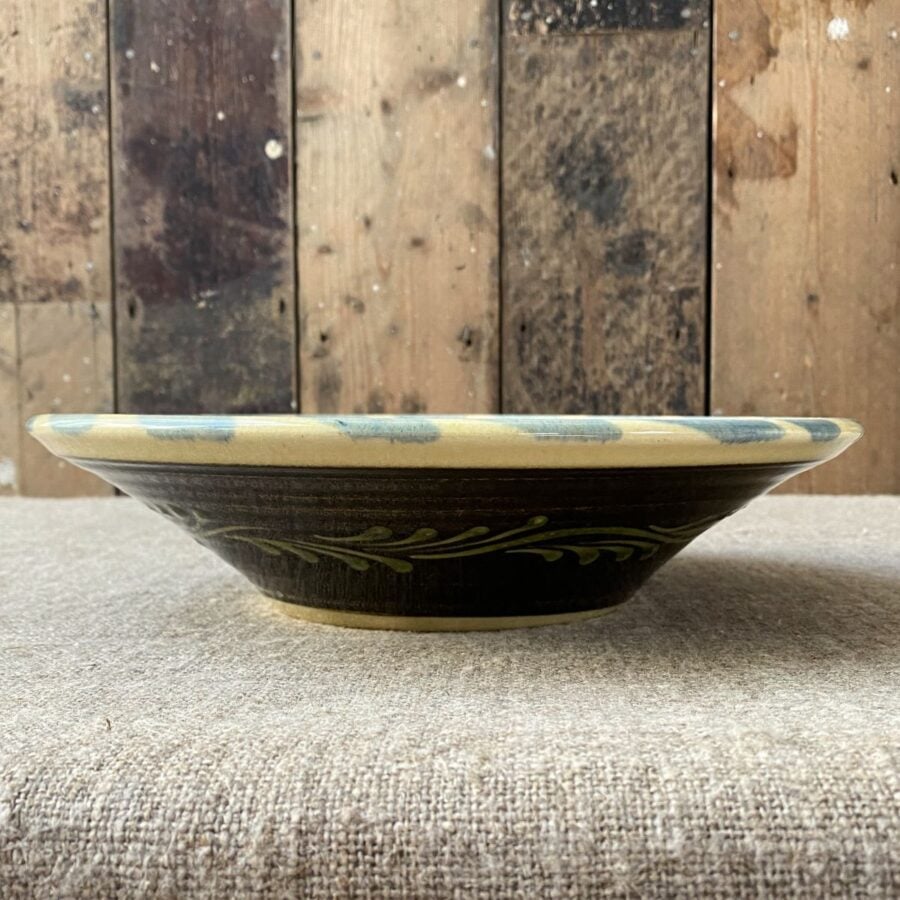 Highly detailed, ceramic slipware daisy bowl by Paul Young