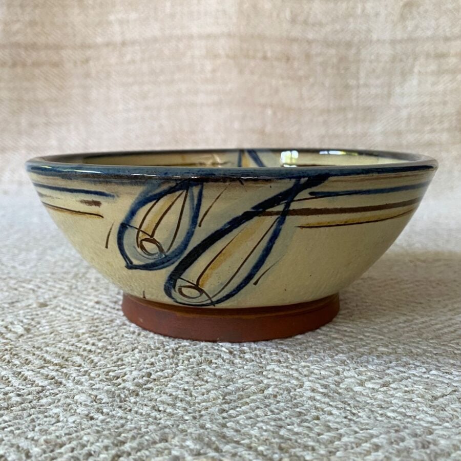 Jennifer Hall Cream Slipware bowl taken from the side, on a cream backcloth