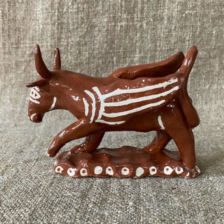 Emma Carlow winged bull pottery whistle against fabric background