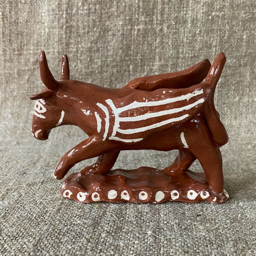 Emma Carlow winged bull pottery whistle against fabric background