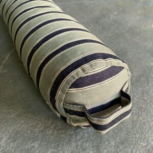 Striped Draught Excluder on a grey stone floor