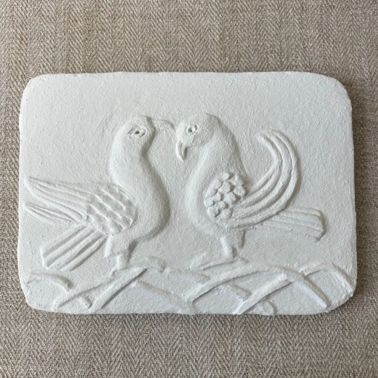 Pargetted lime plaster relief featuring a air of stylised doves