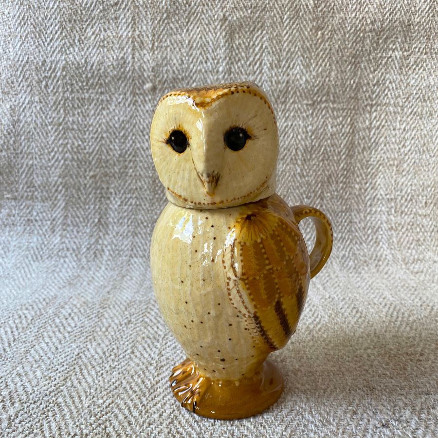 Pottery jug in shape of an ow, with a removable head
