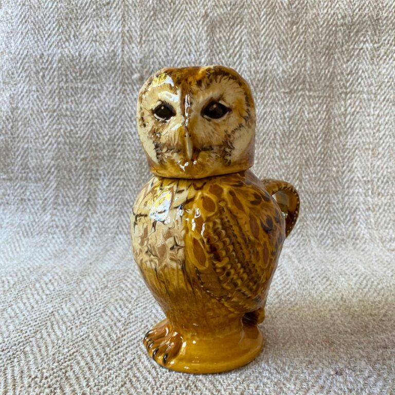 Pottery jug in shape of an ow, with a removable head