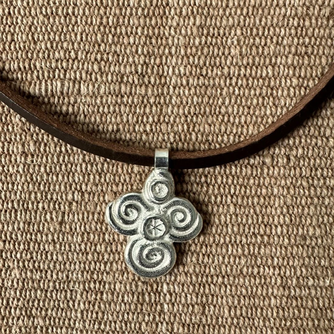 Silver scroll thong necklace