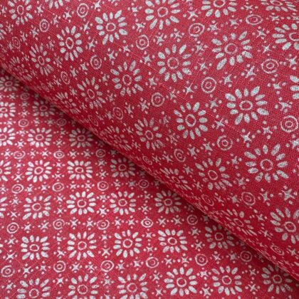 Roll of fabric with a fuschia pink floral design