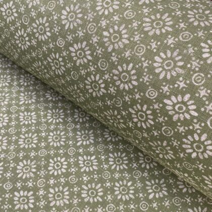 Fabric roll with green, small scale daisy pattern