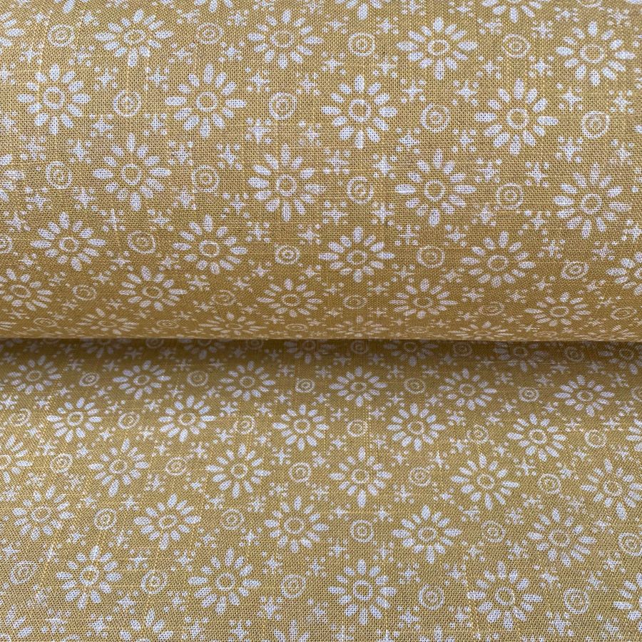 Fabric roll with mustard yellow, small scale daisy pattern