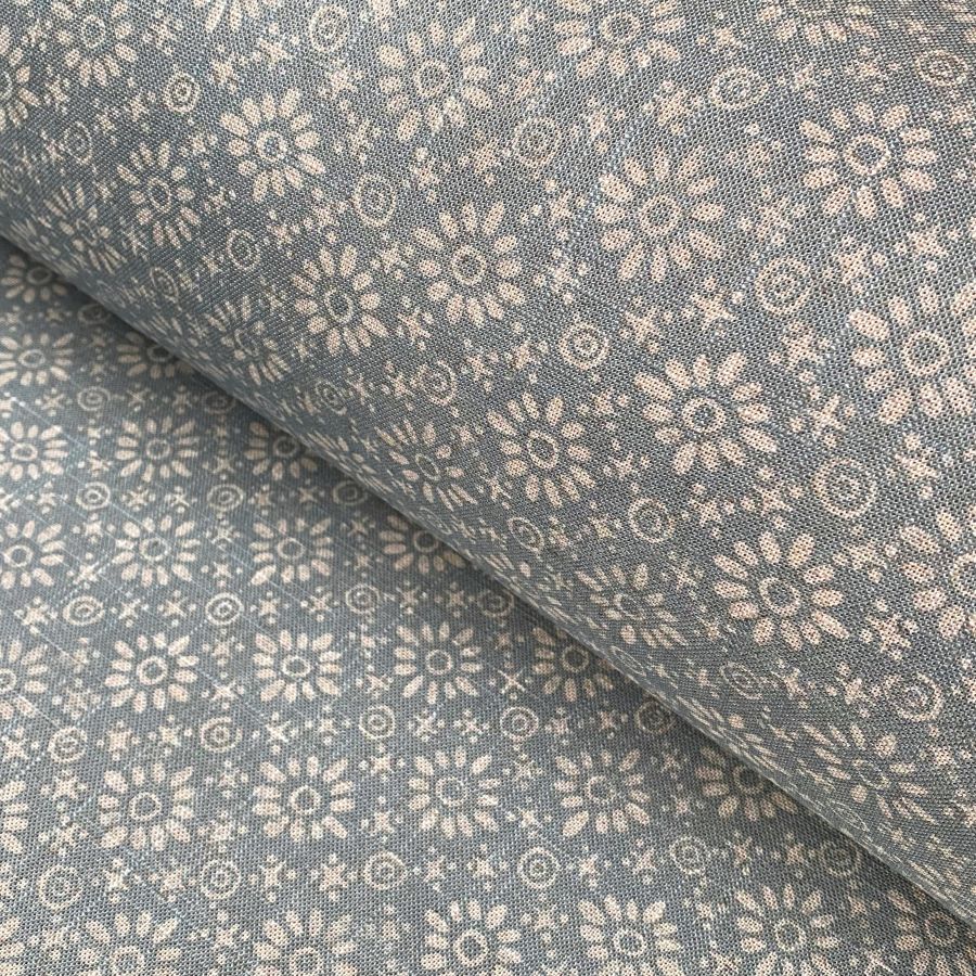 Fabric roll with sea blue, small scale daisy pattern